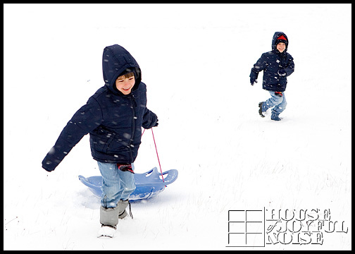 kids snow sledding