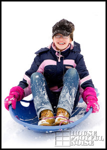 kids snow sledding