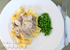 beef stroganoff over noodles with peas