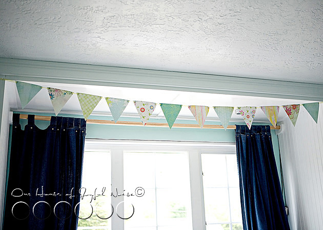 eyeletted-paper-pennants-room-decor-tutorial-11